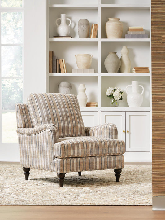 Beige and gray plaid accent chair in a living room setting