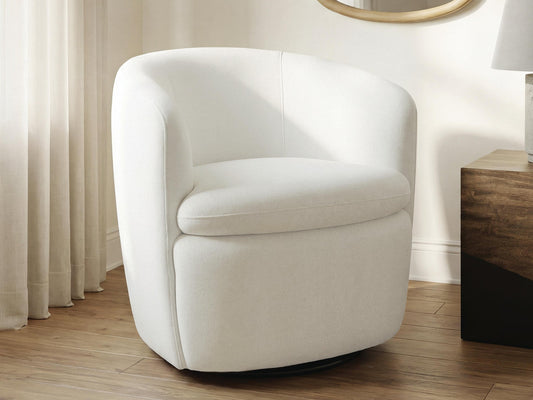 Cream barrel chair on a round living room rug
