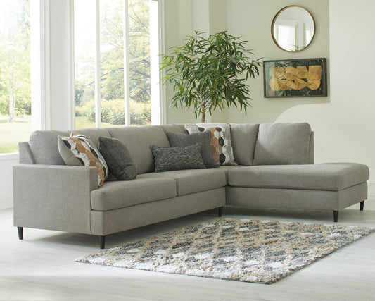 Gray sectional sofa with a right-side chaise in a bright living room