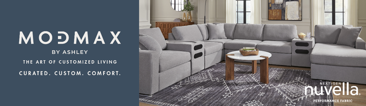 ModMax by Ashley gray sectional sofa with chaise in a living room setting.