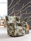 Floral accent chair on a round rug in a living room setting