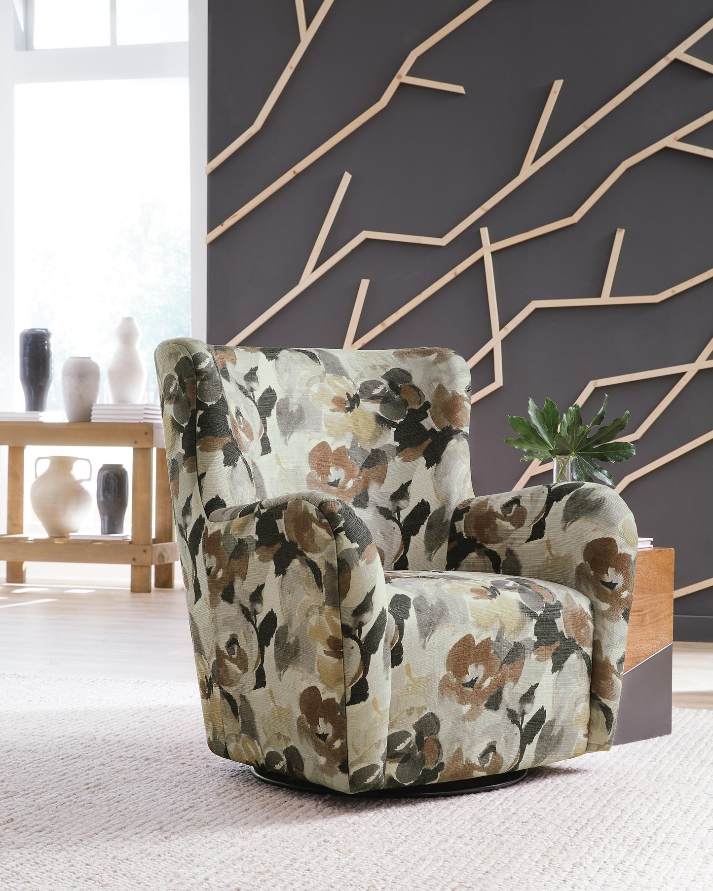 Floral accent chair beside a side table and patterned wall