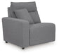 Gray sectional seat with one arm and an accent pillow, angled view