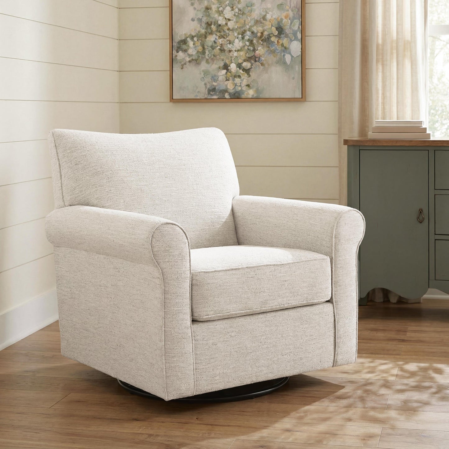 Cream accent chair beside a wooden table in a living room
