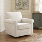 Cream accent chair beside a wooden table in a living room