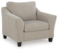 Beige upholstered armchair with dark legs, angled view
