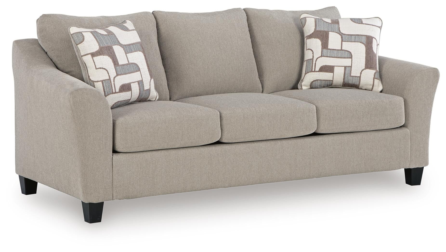 Beige loveseat with patterned accent pillows, angled view