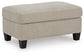Beige rectangular upholstered ottoman, angled view