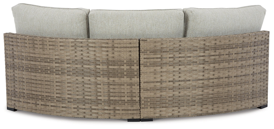 Calworth Curved Loveseat with Cushion Milwaukee Furniture of Chicago - Furniture Store in Chicago Serving Humbolt Park, Roscoe Village, Avondale, & Homan Square