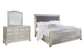 Coralayne King Upholstered Sleigh Bed with Mirrored Dresser Milwaukee Furniture of Chicago - Furniture Store in Chicago Serving Humbolt Park, Roscoe Village, Avondale, & Homan Square